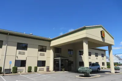a building with a parking lot in front of it at Super 8 by Wyndham Port Clinton in Port Clinton