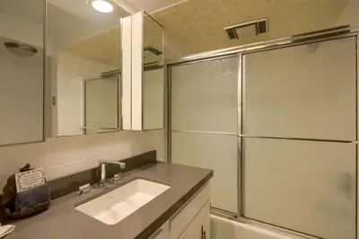 a bathroom with a sink and a shower at Mercer House in Sugar Grove