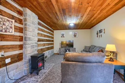 a living room with a couch and a fireplace at Navajo in Logan