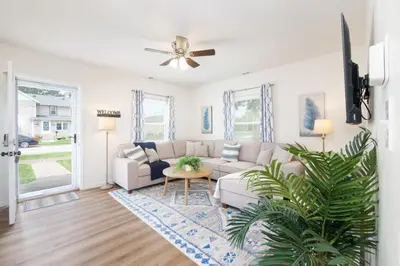 a living room with a couch and a table at Port Clinton Getaway Near the Beach in Port Clinton