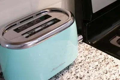 a toaster sitting on a counter next to a stove at Modern 3BR home next to park, office space, & more in University Heights