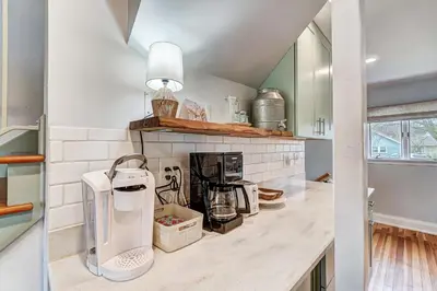 a kitchen with a counter with a appliance on it at The Meeker House (Charming 3/4 Bedroom Home) in Bowling Green