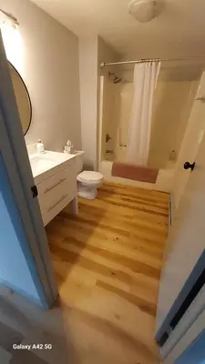 a bathroom with a sink and a toilet and a shower at The Meeker House (Charming 3/4 Bedroom Home) in Bowling Green