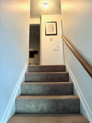 a staircase in a home with a stair case at Home in Hudson in Hudson