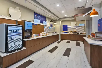 an apple store with a cash register and aasteryasteryasteryasteryasteryasteryastery at Holiday Inn Express & Suites - Milan - Sandusky Area by IHG in Milan