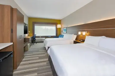 a hotel room with two beds and a large window at Holiday Inn Express & Suites - Milan - Sandusky Area by IHG in Milan