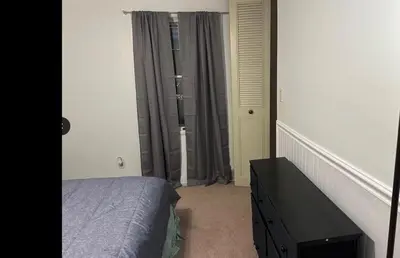 a bedroom with a bed and a window at Home in Hudson in Hudson