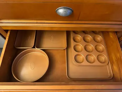 a drawer in a wooden cabinet with a drawer at The House Hotel Elmwood in Lakewood