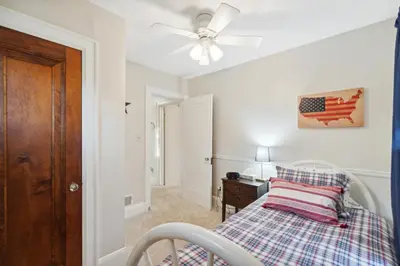 a bedroom with a bed and a ceiling fan at Exclusive Ottawa Hills Private Home, Garage, WD, Gourmet Equipped kitchen, Netflix in Ottawa Hills