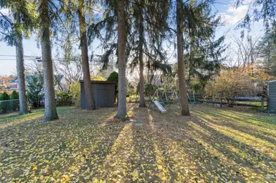 a group of trees in a field with a park at Exclusive Ottawa Hills Private Home, Garage, WD, Gourmet Equipped kitchen, Netflix in Ottawa Hills