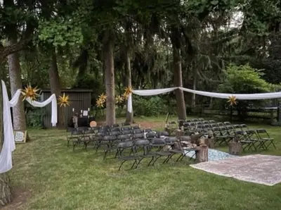 an outdoor wedding with chairs and a bunch ofbons at Exclusive Ottawa Hills Private Home, Garage, WD, Gourmet Equipped kitchen, Netflix in Ottawa Hills