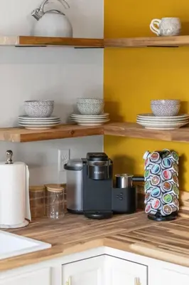 a kitchen with wooden shelves with dishes and appliances at The Luxe/HotTub/Playground/12min KHP/30min Ark in Georgetown