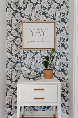 a white dresser with a picture on a wall with flowers at The Luxe/HotTub/Playground/12min KHP/30min Ark in Georgetown