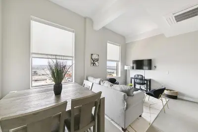 a living room with a table and a couch at Downtown/Bengals/Reds/TQL/OTR in Cincinnati