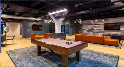 a room with a pool table and couches at Downtown/Bengals/Reds/TQL/OTR in Cincinnati