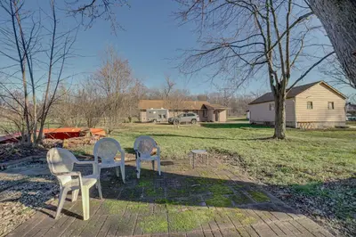 three chairs and a table in a yard at Quaint Youngstown Home about 2 Mi to Boardman Park! in Youngstown