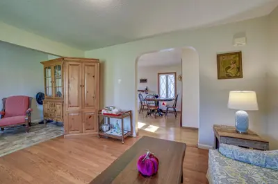 a living room with a couch and a table at Quaint Youngstown Home about 2 Mi to Boardman Park! in Youngstown