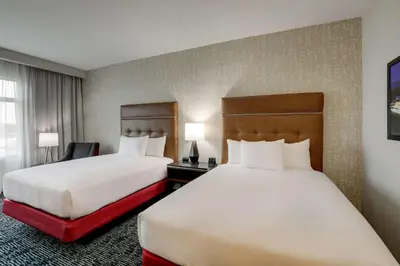 a hotel room with two beds and a window at Drury Plaza Hotel Cincinnati Florence in Florence
