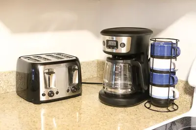 a coffee maker and a toaster sitting on a counter at Bay Lodging Resort in Put-in-Bay