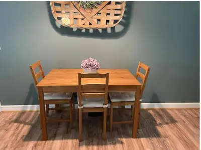 a wooden table with chairs and a vase of flowers on it at Rise and Shine! A Gorge-ous cabin! in Korea