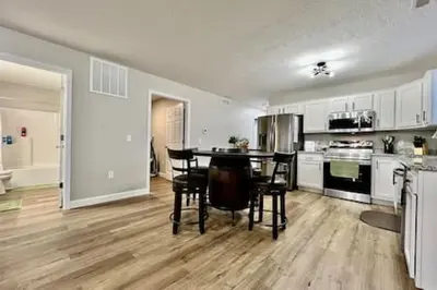 a large kitchen with a table and chairs in it at Nicest New construction Home in Middletown, Ohio in Middletown