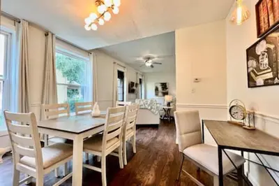 a dining room with a table and chairs at 1 Bd Hide away Historic Dayton, Oh Oregon District in Dayton