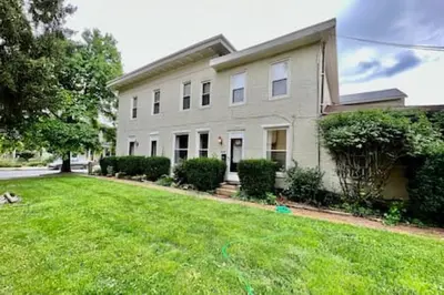 a house with a green yard in front of it at 1 Bd Hide away Historic Dayton, Oh Oregon District in Dayton