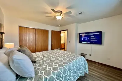 a bedroom with a bed and a ceiling fan at Charming remodeled 2 bed GEM Middletown in Middletown