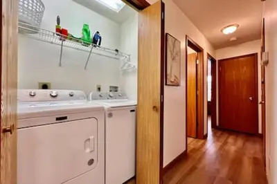 a kitchen with a washer and dryer in a room at Charming remodeled 2 bed GEM Middletown in Middletown