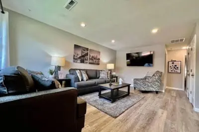 a living room with a couch and a table at Remodeled 2 BDRM Ranch Attached Home Liberty, TWP in Rockdale