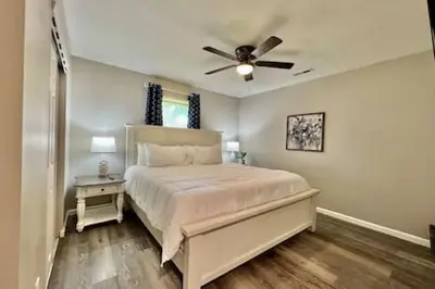 a bedroom with a bed with a ceiling fan at Remodeled 2 BDRM Ranch Attached Home Liberty, TWP in Rockdale