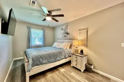 a bedroom with a bed and a ceiling fan at Remodeled 2 BDRM Ranch Attached Home Liberty, TWP in Rockdale