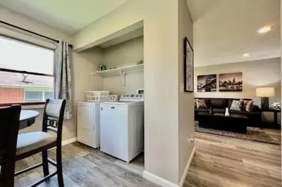 a kitchen and living room with a table and a dining room at Remodeled 2 BDRM Ranch Attached Home Liberty, TWP in Rockdale