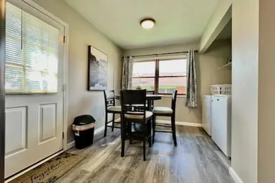 a kitchen and dining room with a table and chairs at Remodeled 2 BDRM Ranch Attached Home Liberty, TWP in Rockdale