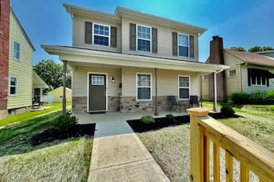 a house with a wooden fence in front of it at Brand New Home Walking distance to Spooky Nook in Hamilton