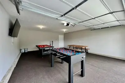 a room with two ping pong tables in it at Brand New Home Walking distance to Spooky Nook in Hamilton