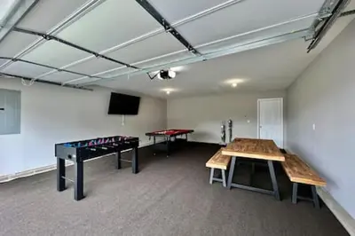 a room with a ping pong table and a ping pong table at Brand New Home Walking distance to Spooky Nook in Hamilton
