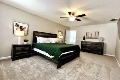 a bedroom with a bed and a ceiling fan at NEW Executive Home in Germantown, OH in Germantown