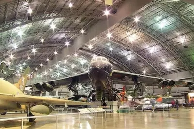 a plane parked in a hangar with other planes at NEW Executive Home in Germantown, OH in Germantown