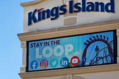 a sign on the side of a building with a roller coaster at 5104 Cartridge Factory Loft in Maineville