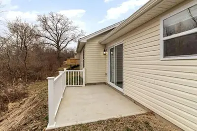 a house with a walkway leading to a door at Quietly nestled home among the Nook in Hamilton