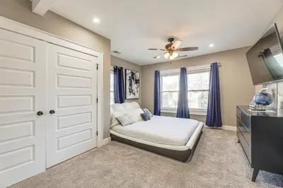 a bedroom with a bed and a window at Charming Cincinnati Home with Spacious Deck! in Cincinnati