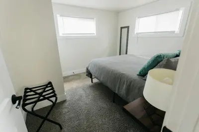 a bedroom with a bed and a bathroom with a sink at Great Location in Dayton! Updated 1 bedroom/bath. in Dayton