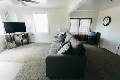 a living room with a couch and a tv at Great Location in Dayton! Updated 1 bedroom/bath. in Dayton