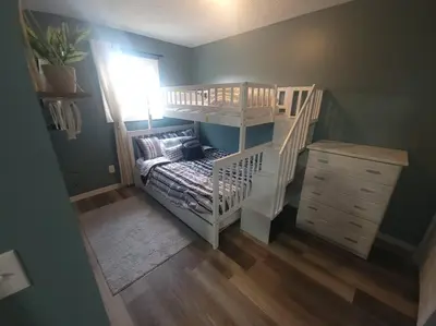 a childs room with a bunk bed and a staircase at Hidden Gem close to Athens/Logan in Nelsonville