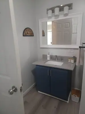 a bathroom with a sink and a mirror at Hidden Gem close to Athens/Logan in Nelsonville