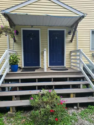 a house with blue doors and a porch at Hidden Gem close to Athens/Logan in Nelsonville