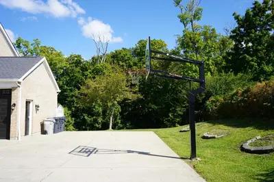 a basketball hoop in front of a house at Walkout Basement Near Creation Museum in Hebron