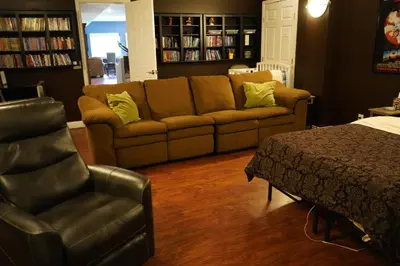 a living room with a couch and a chair at Walkout Basement Near Creation Museum in Hebron