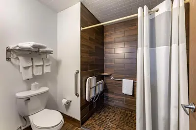 a bathroom with a toilet and a shower at Quality Inn Austintown-Youngstown West in Youngstown